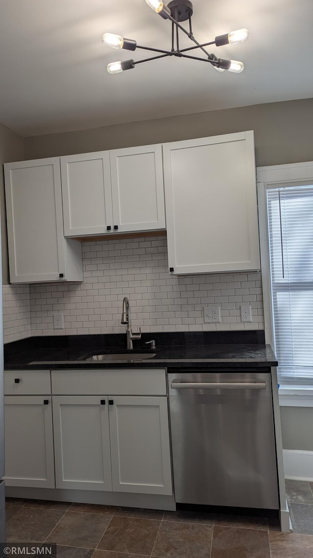 3454 Newton Ave N, Minneapolis, MN 55412 - kitchen with dishwasher, a sink, dark countertops, decorative backsplash, and white cabinetry