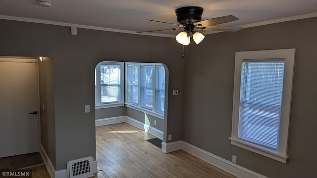 3454 Newton Ave N, Minneapolis, MN 55412 - unfurnished room featuring ornamental molding, a ceiling fan, wood finished floors, a smoke detector, and baseboards
