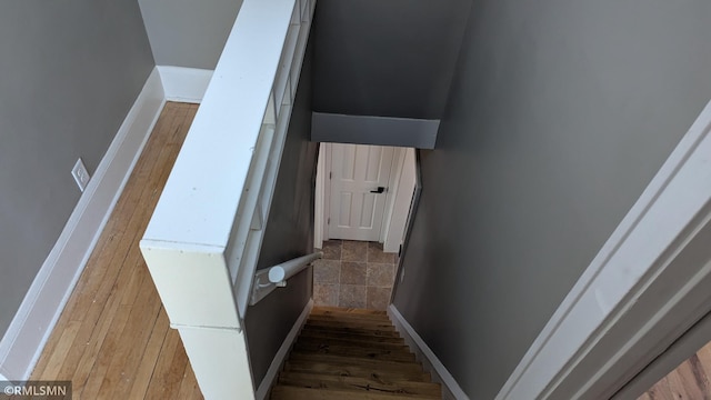 3454 Newton Ave N, Minneapolis, MN 55412 - staircase featuring wood finished floors and baseboards