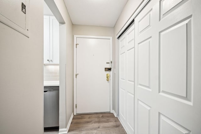 329 Geneva Ave N Unit 212, Oakdale, MN 55128 - doorway featuring light wood-style flooring and baseboards