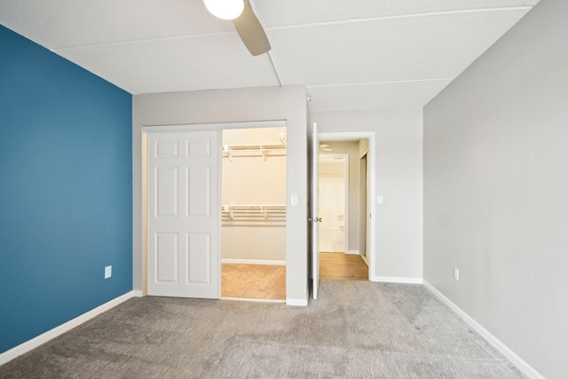 329 Geneva Ave N Unit 212, Oakdale, MN 55128 - unfurnished bedroom with carpet, a closet, baseboards, and a ceiling fan
