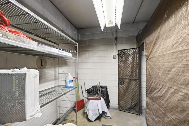 329 Geneva Ave N Unit 212, Oakdale, MN 55128 - interior space with finished concrete flooring and concrete block wall