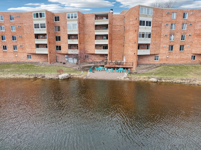 329 Geneva Ave N Unit 212, Oakdale, MN 55128 - view of building exterior featuring a water view
