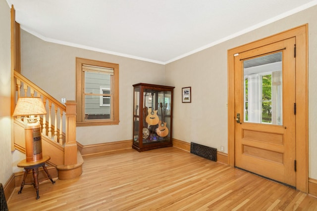 1757 Minnehaha Ave W, Saint Paul, MN 55104 - foyer featuring wood finished floors, crown molding, stairs, and baseboards