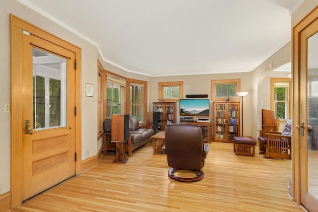 1757 Minnehaha Ave W, Saint Paul, MN 55104 - sitting room featuring french doors, arched walkways, light wood-style flooring, and crown molding