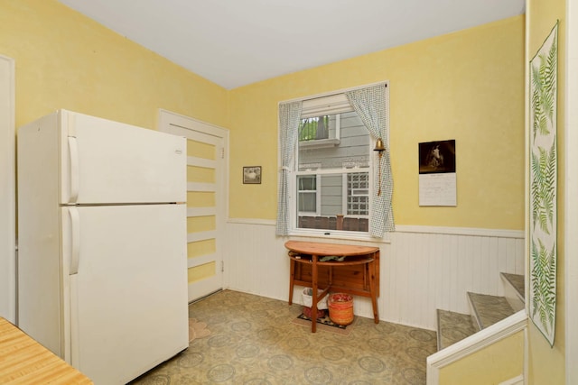 1757 Minnehaha Ave W, Saint Paul, MN 55104 - kitchen featuring freestanding refrigerator and a wainscoted wall