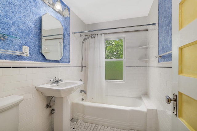 1757 Minnehaha Ave W, Saint Paul, MN 55104 - full bath with tile walls, shower / bath combo, tile patterned floors, toilet, and wainscoting