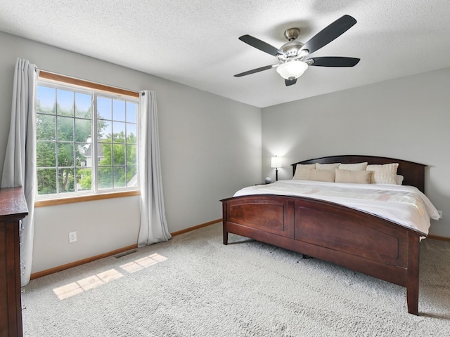 7647 Nicholas Way, Chanhassen, MN 55317 - bedroom featuring light colored carpet, baseboards, ceiling fan, and a textured ceiling