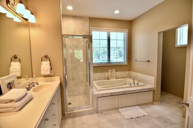 13258 Derryglenn Ct, Rosemount, MN 55068 - full bath with a bath, a stall shower, vanity, tile patterned flooring, and recessed lighting