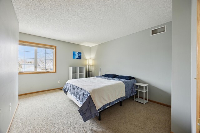 640 Falcon Ridge Rd, Woodbury, MN 55125 - bedroom featuring carpet flooring, a textured ceiling, and baseboards