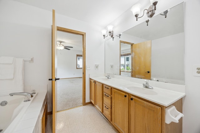 640 Falcon Ridge Rd, Woodbury, MN 55125 - bathroom with double vanity, a garden tub, healthy amount of natural light, and a ceiling fan