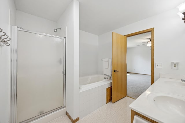 640 Falcon Ridge Rd, Woodbury, MN 55125 - bathroom featuring a shower stall, ceiling fan, a garden tub, and double vanity
