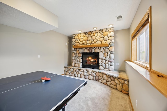 640 Falcon Ridge Rd, Woodbury, MN 55125 - recreation room with a stone fireplace and carpet flooring
