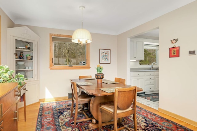 dining room featuring visible vents and light wood-style flooring