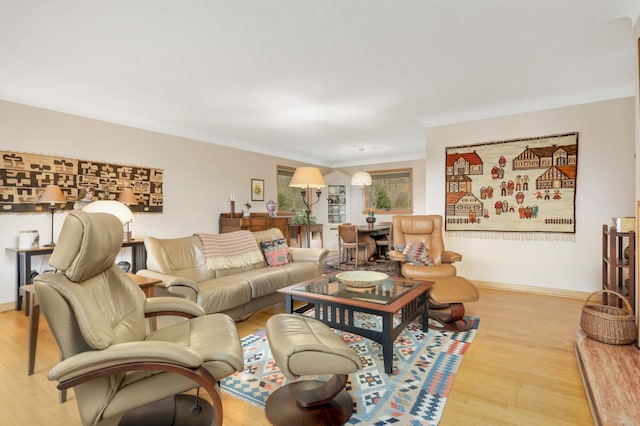 living room featuring baseboards and wood finished floors
