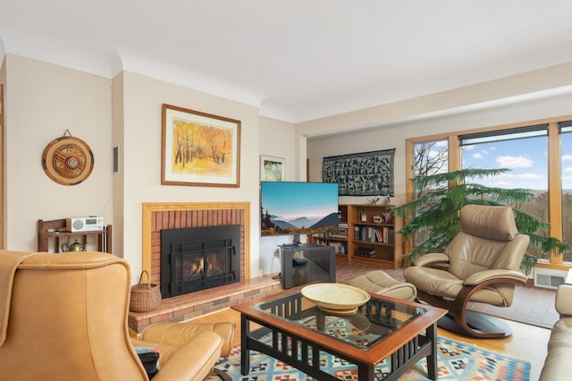 living room with a fireplace and visible vents