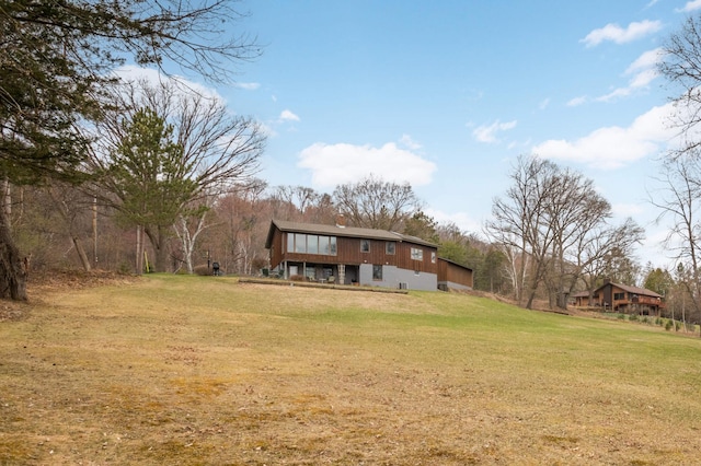 back of house with a yard