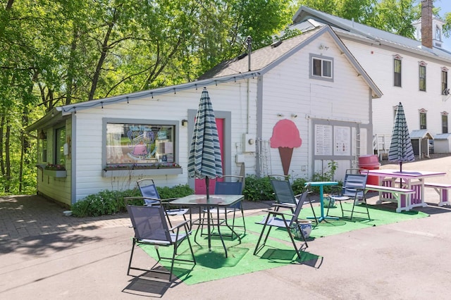 rear view of house featuring a patio