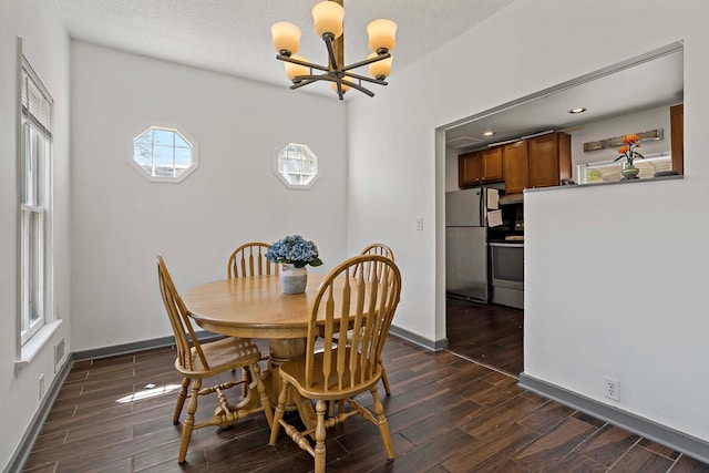 dining area featuring a chandelier, dark wood-style flooring, baseboards, and recessed lighting