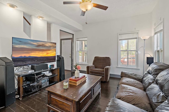 living room featuring a ceiling fan