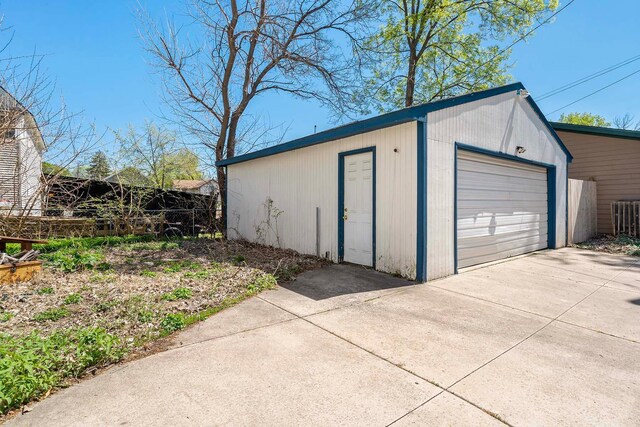 1213 26th St, Minneapolis, MN 55404 - detached garage with driveway and fence
