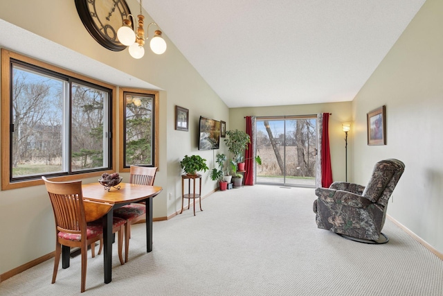 sitting room featuring vaulted ceiling, baseboards, carpet, and a chandelier