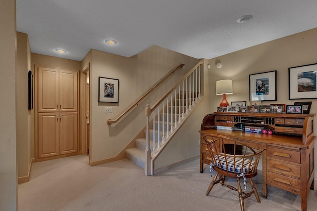 stairway featuring carpet flooring and baseboards