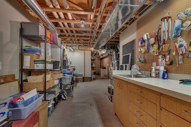 unfinished below grade area featuring a sink and washer / clothes dryer