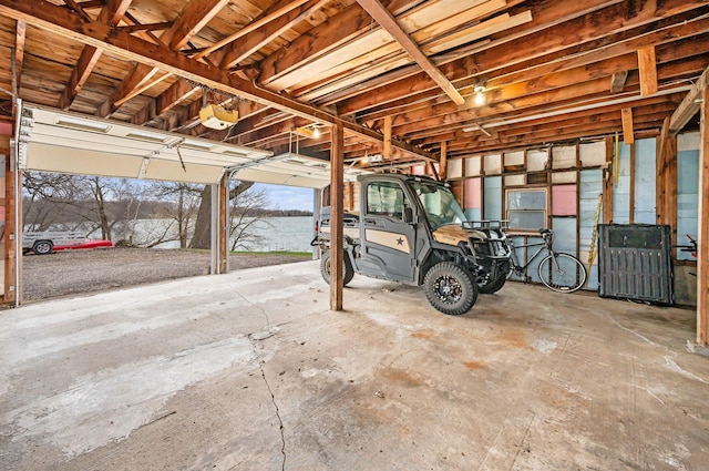garage featuring a water view and a garage door opener
