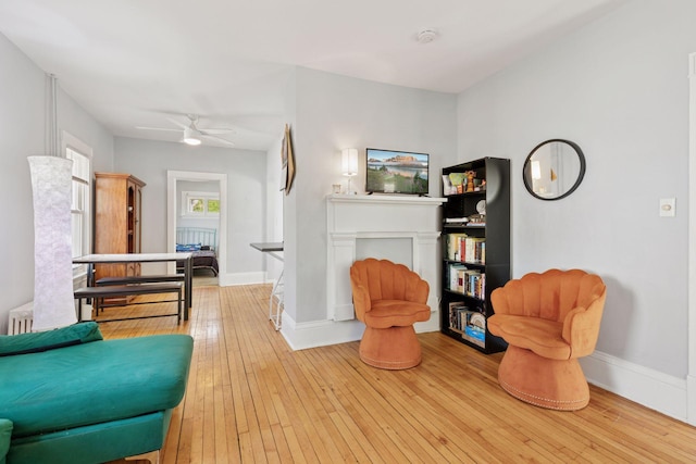 2822 29th St, Minneapolis, MN 55406 - sitting room featuring baseboards, wood-type flooring, and a ceiling fan