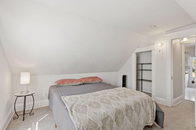 2822 29th St, Minneapolis, MN 55406 - carpeted bedroom featuring lofted ceiling and baseboards