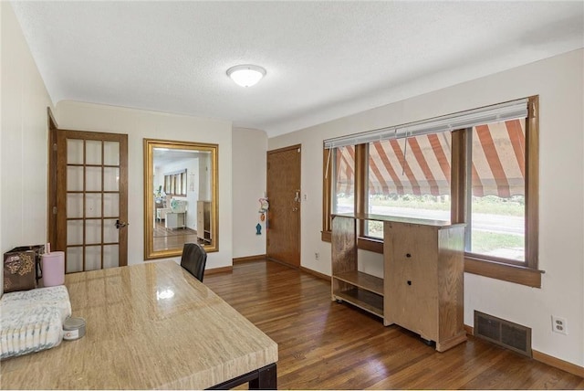 2411 Mcmenemy St, Little Canada, MN 55117 - office area with dark wood-type flooring, baseboards, and visible vents