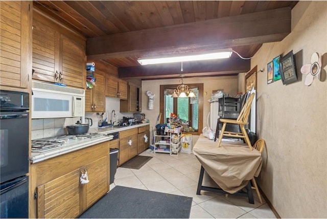 2411 Mcmenemy St, Little Canada, MN 55117 - kitchen with brown cabinetry, light tile patterned flooring, a sink, and white appliances
