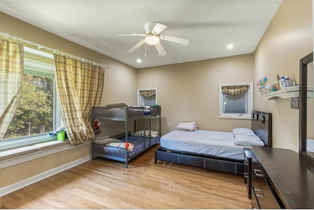 2411 Mcmenemy St, Little Canada, MN 55117 - bedroom with baseboards, light wood finished floors, ceiling fan, and recessed lighting