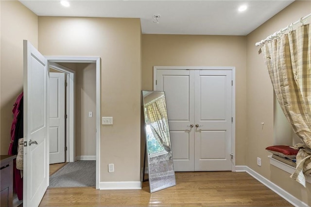 2411 Mcmenemy St, Little Canada, MN 55117 - bedroom featuring a closet, baseboards, recessed lighting, and wood finished floors