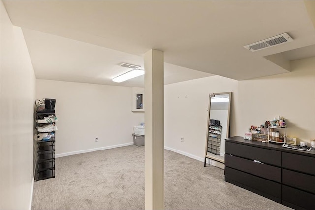 2411 Mcmenemy St, Little Canada, MN 55117 - finished below grade area with light carpet, electric panel, visible vents, and baseboards
