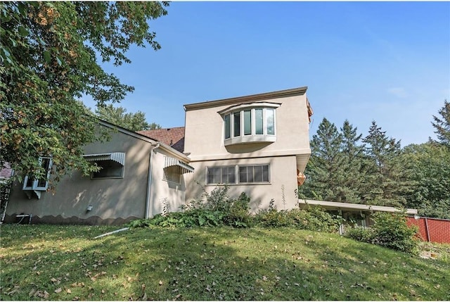 2411 Mcmenemy St, Little Canada, MN 55117 - rear view of house with a yard and stucco siding