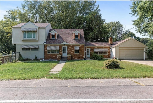 2411 Mcmenemy St, Little Canada, MN 55117 - cape cod home with entry steps, driveway, a front lawn, and a garage