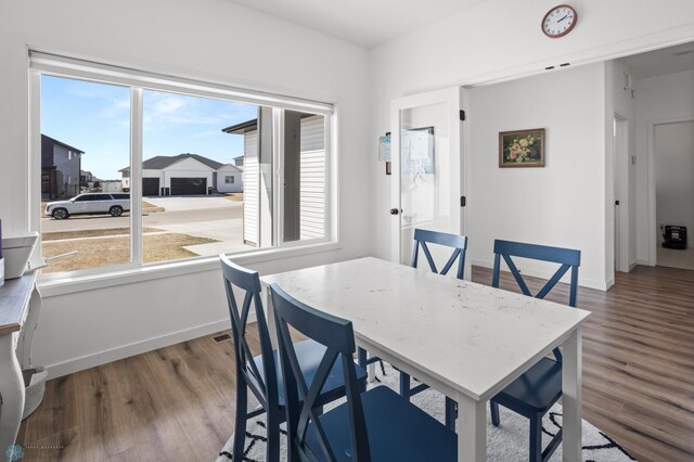5497 11th St W, West Fargo, ND 58078 - dining space with wood finished floors and baseboards