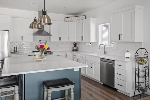 5497 11th St W, West Fargo, ND 58078 - kitchen featuring white cabinetry, a breakfast bar area, stainless steel appliances, and a sink
