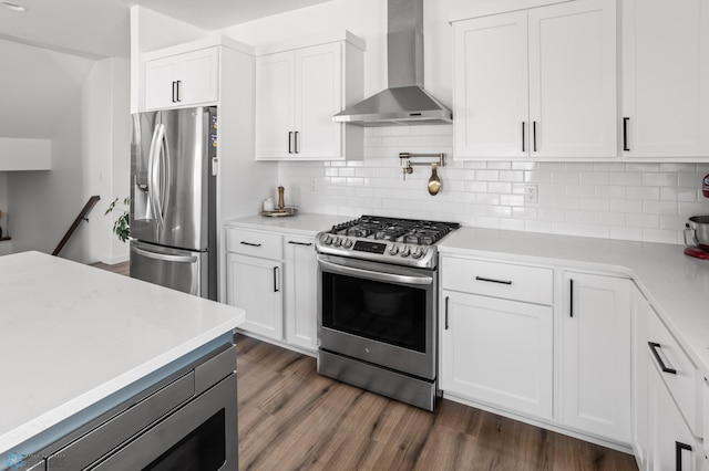 5497 11th St W, West Fargo, ND 58078 - kitchen with wall chimney range hood, stainless steel appliances, white cabinets, and light countertops