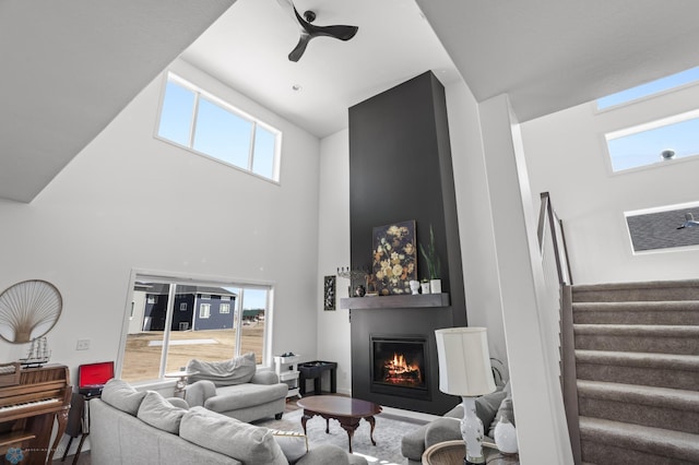 5497 11th St W, West Fargo, ND 58078 - living area featuring a high ceiling, a fireplace, and stairway
