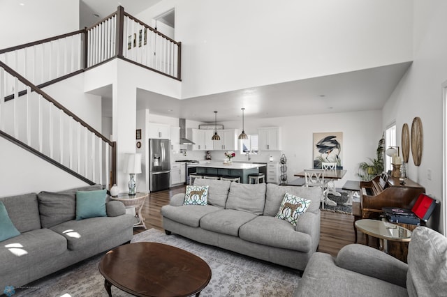 5497 11th St W, West Fargo, ND 58078 - living room with wood finished floors, a towering ceiling, and stairway