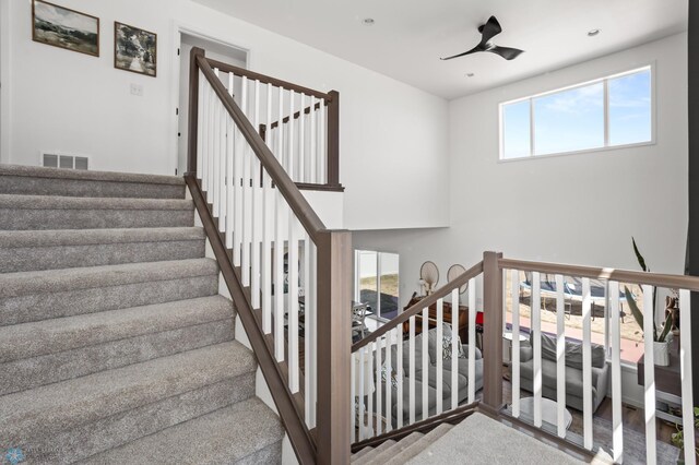 5497 11th St W, West Fargo, ND 58078 - stairway with a ceiling fan and visible vents