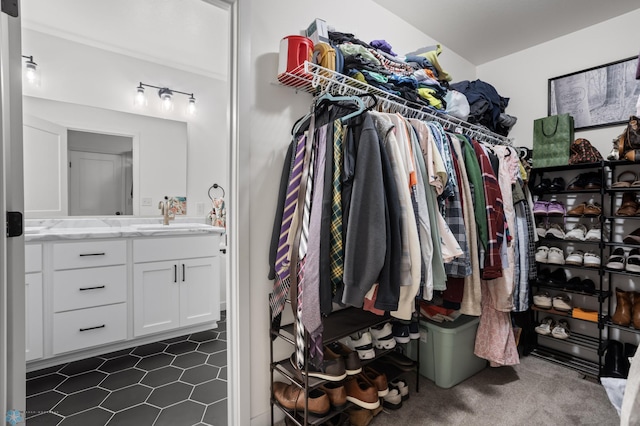5497 11th St W, West Fargo, ND 58078 - spacious closet with dark tile patterned floors and a sink