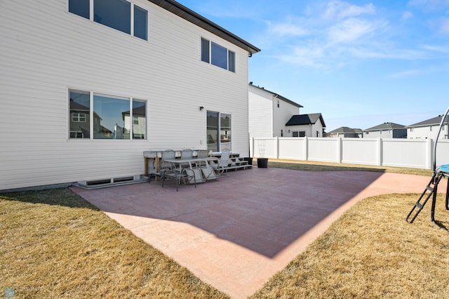 5497 11th St W, West Fargo, ND 58078 - back of house with a patio area, a lawn, and fence