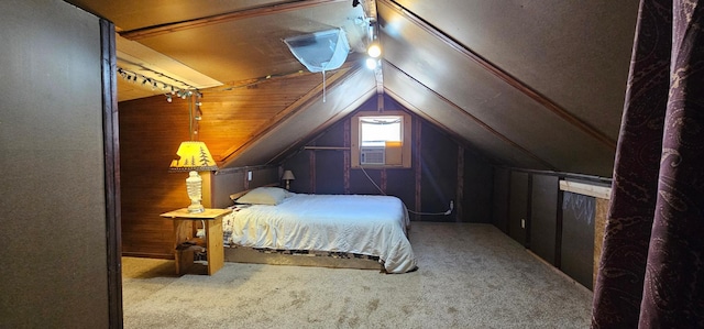 carpeted bedroom featuring cooling unit and vaulted ceiling