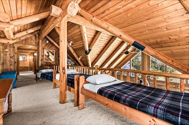 10001 Tomahawk Ln, Ray, MN 56669 - carpeted bedroom with arched walkways, vaulted ceiling with beams, wood ceiling, and wood walls