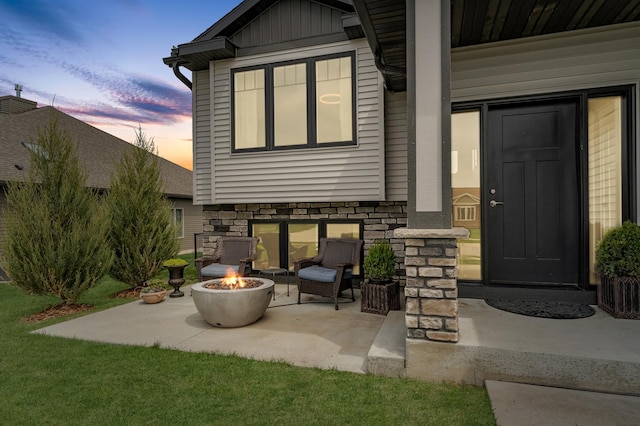 4594 Buckingham Dr NW, Rochester, MN 55901 - view of patio featuring an outdoor fire pit