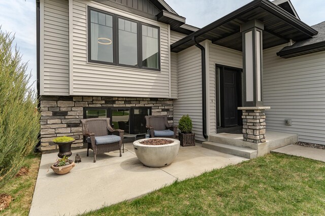 4594 Buckingham Dr NW, Rochester, MN 55901 - view of patio with an outdoor fire pit